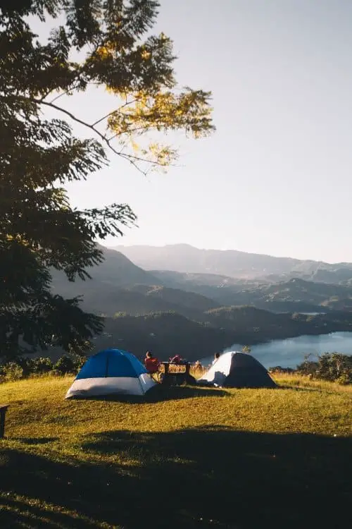 Two tents overlooking moutains and lake
